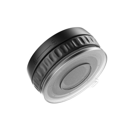 Metallic gray circular object with textured surface on white background