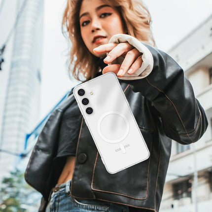 Person holding a white smartphone with a black leather jacket in an urban setting for Samsung S25